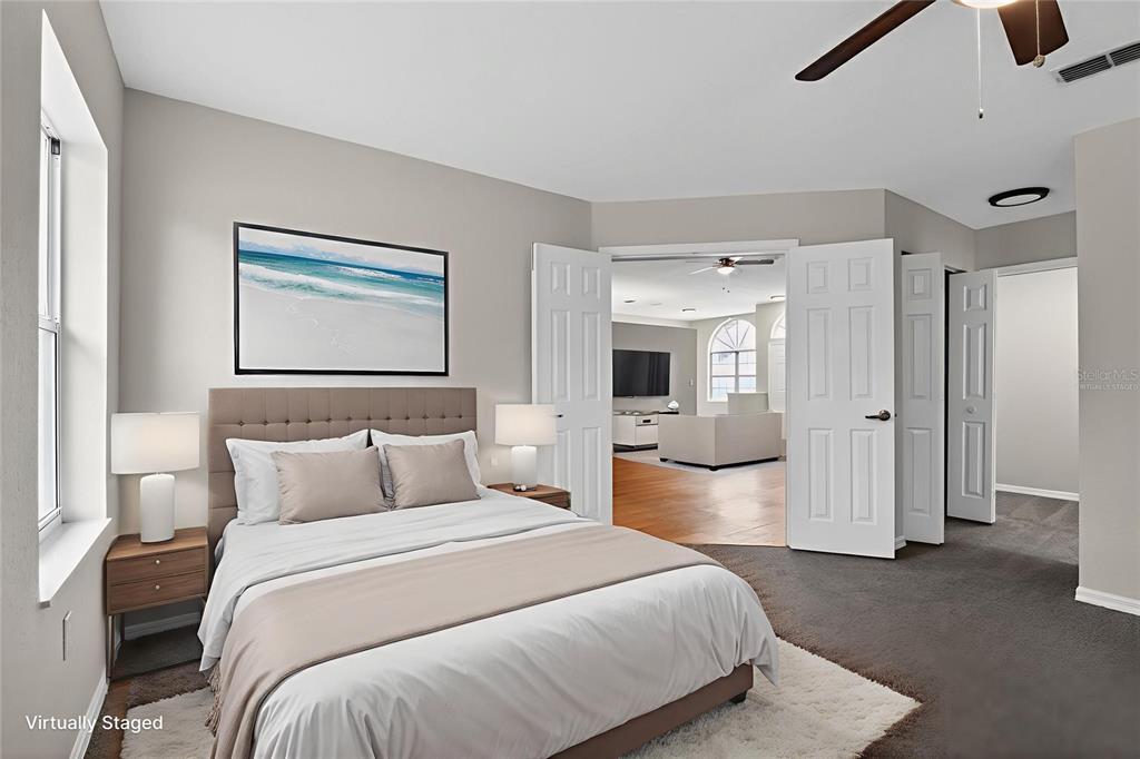 11443 Southwest 78th Circle Ocala, FL 34476 - Photo 17 of 33 a bedroom with a large bed and furniture