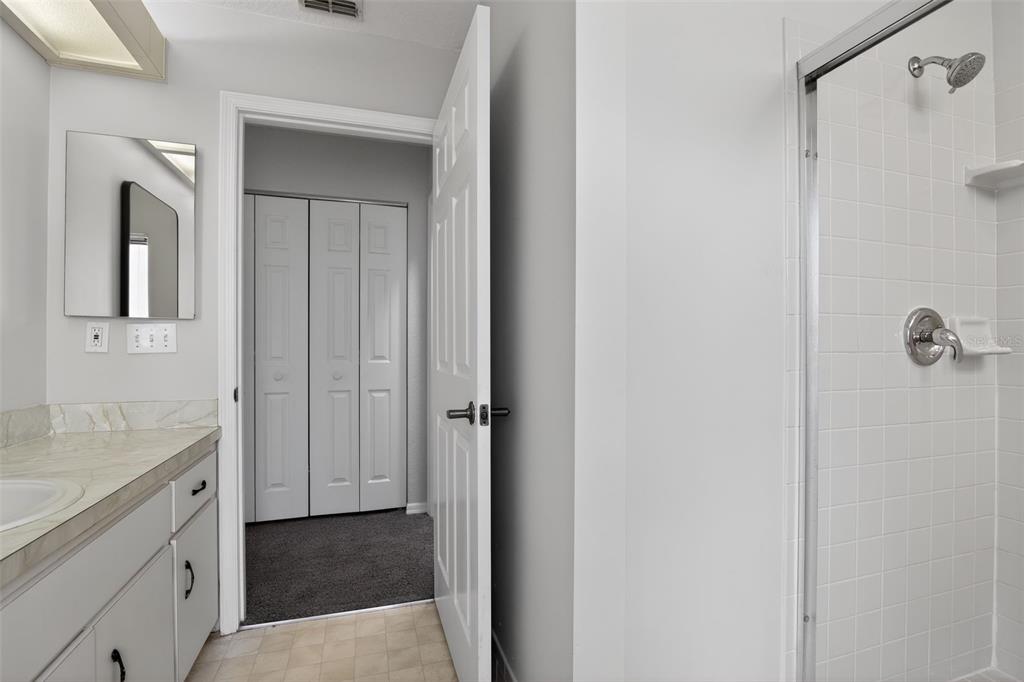 11443 Southwest 78th Circle Ocala, FL 34476 - Photo 19 of 33 a bathroom with a sink and mirror