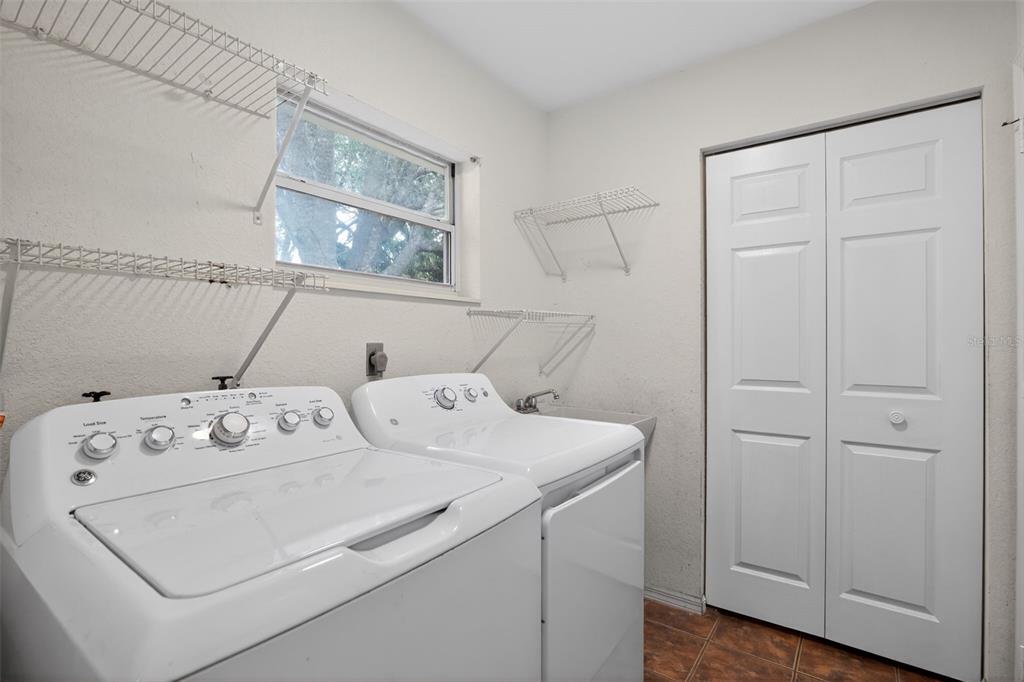 11443 Southwest 78th Circle Ocala, FL 34476 - Photo 25 of 33 a utility room with dryer and washer