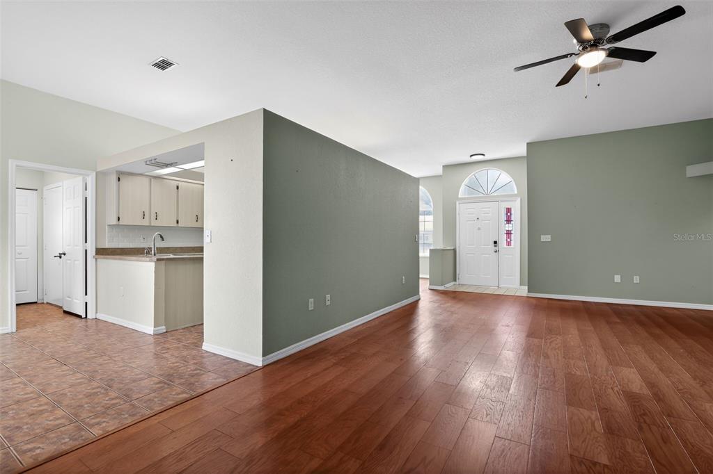 11443 Southwest 78th Circle Ocala, FL 34476 - Photo 6 of 33 a view of a kitchen with a sink and a refrigerator