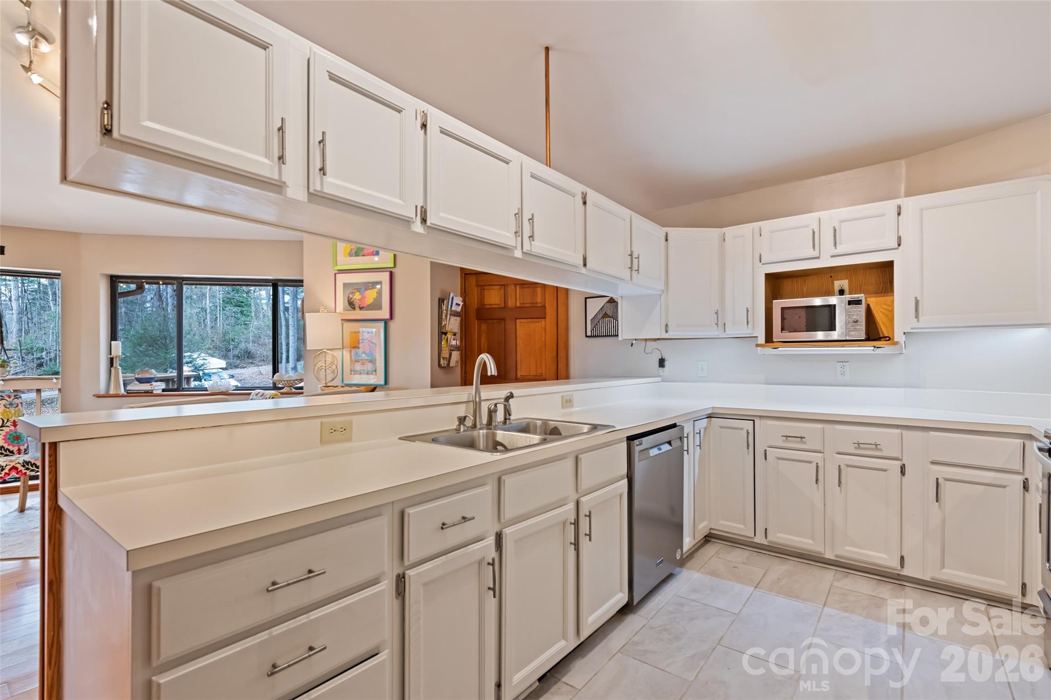 12 Shady Lane Candler, NC 28715 - Photo 6 of 21 a kitchen with sink cabinets and window