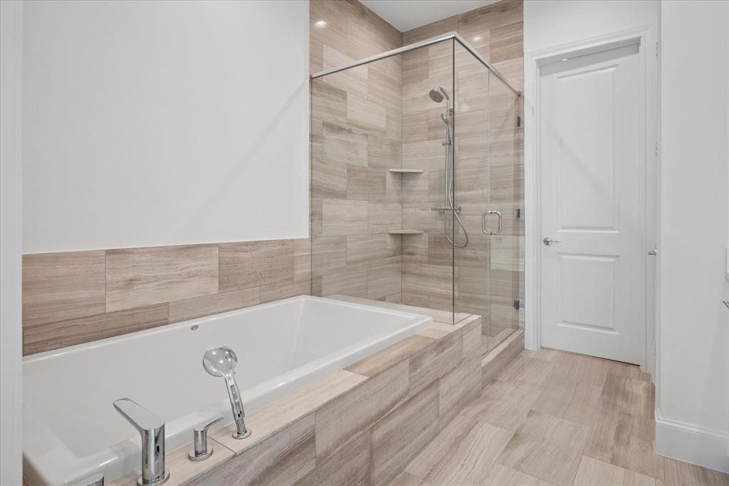 5029 Magnolia Street Addison, TX 75001 - Photo 15 of 25 Bathroom with a stall shower and a garden tub