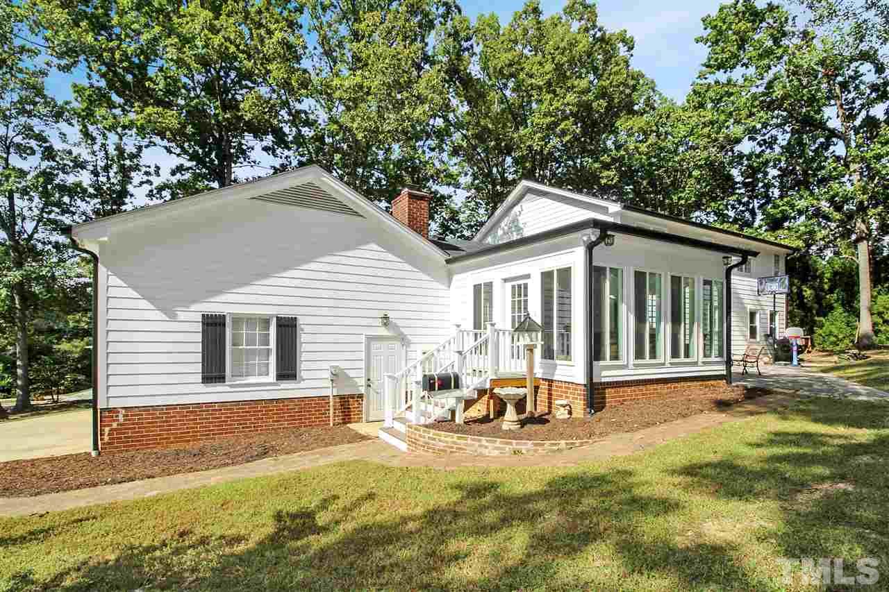 1408 Hunting Ridge Road Raleigh, NC 27615 - Photo 22 of 25 a view of a house with backyard and sitting area