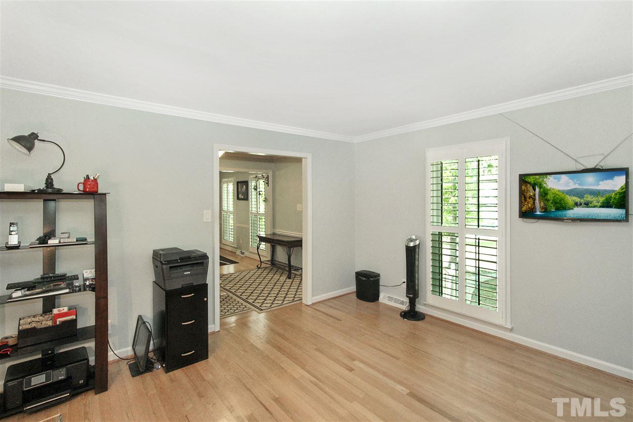 1408 Hunting Ridge Road Raleigh, NC 27615 - Photo 8 of 25 a view of a livingroom with furniture and wooden floor