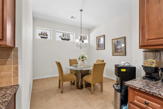 a dining room with furniture and window