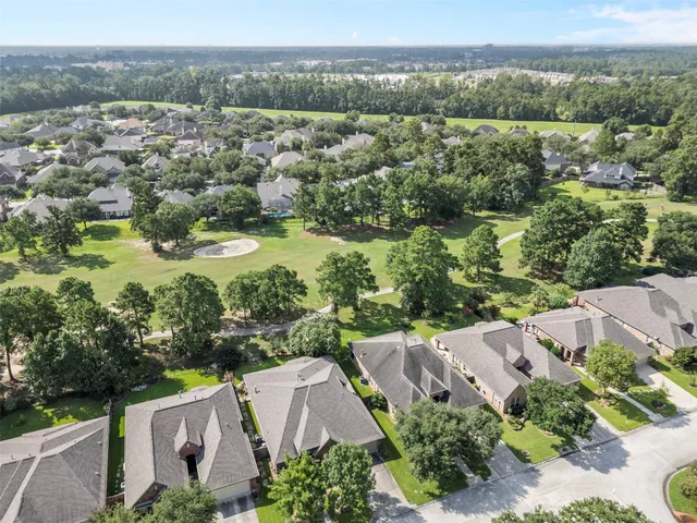 an aerial view of a house with a lake view