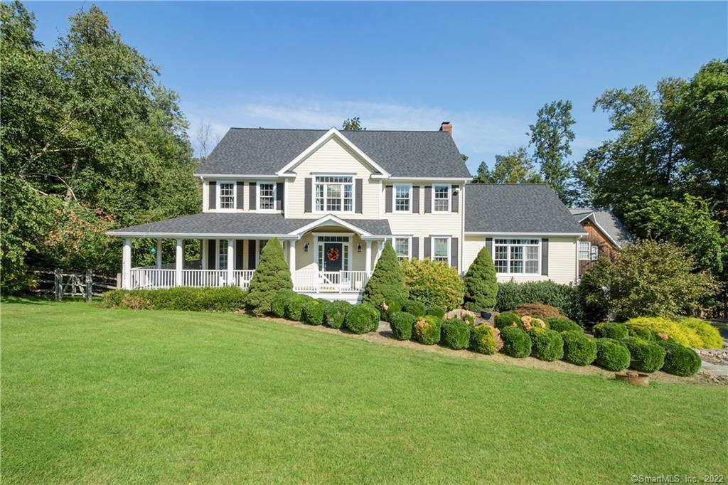 11 Cider Mill Road Newtown, CT 06482 - Photo 1 of 1 a front view of a house with a garden