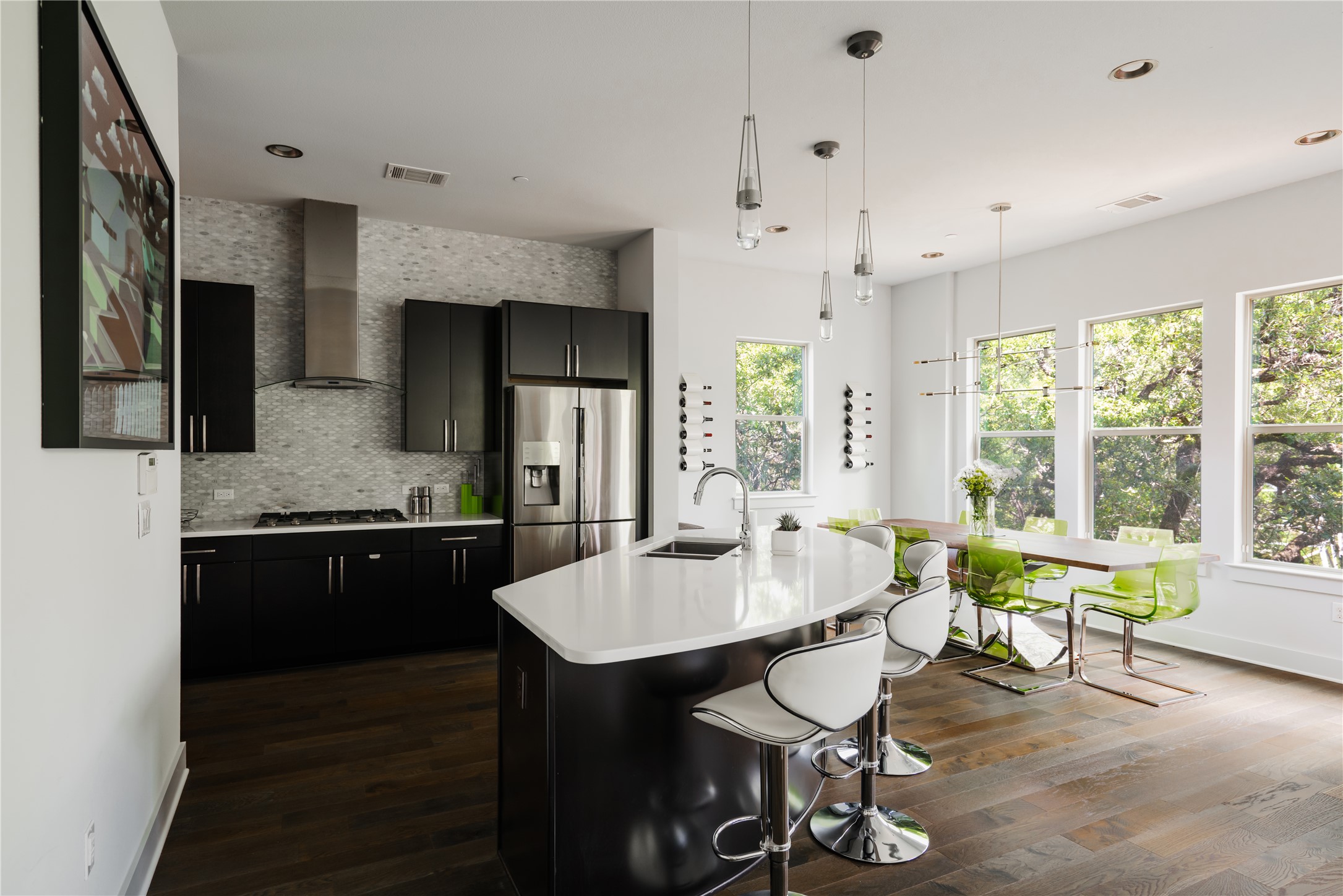 8110 Ranch Road 2222, Unit 36 Austin, TX 78730 - Photo 11 of 31 a kitchen with a table chairs stove and refrigerator