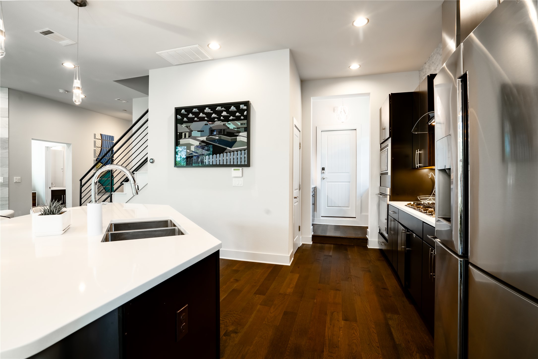 8110 Ranch Road 2222, Unit 36 Austin, TX 78730 - Photo 12 of 31 a kitchen with a sink appliances and cabinets