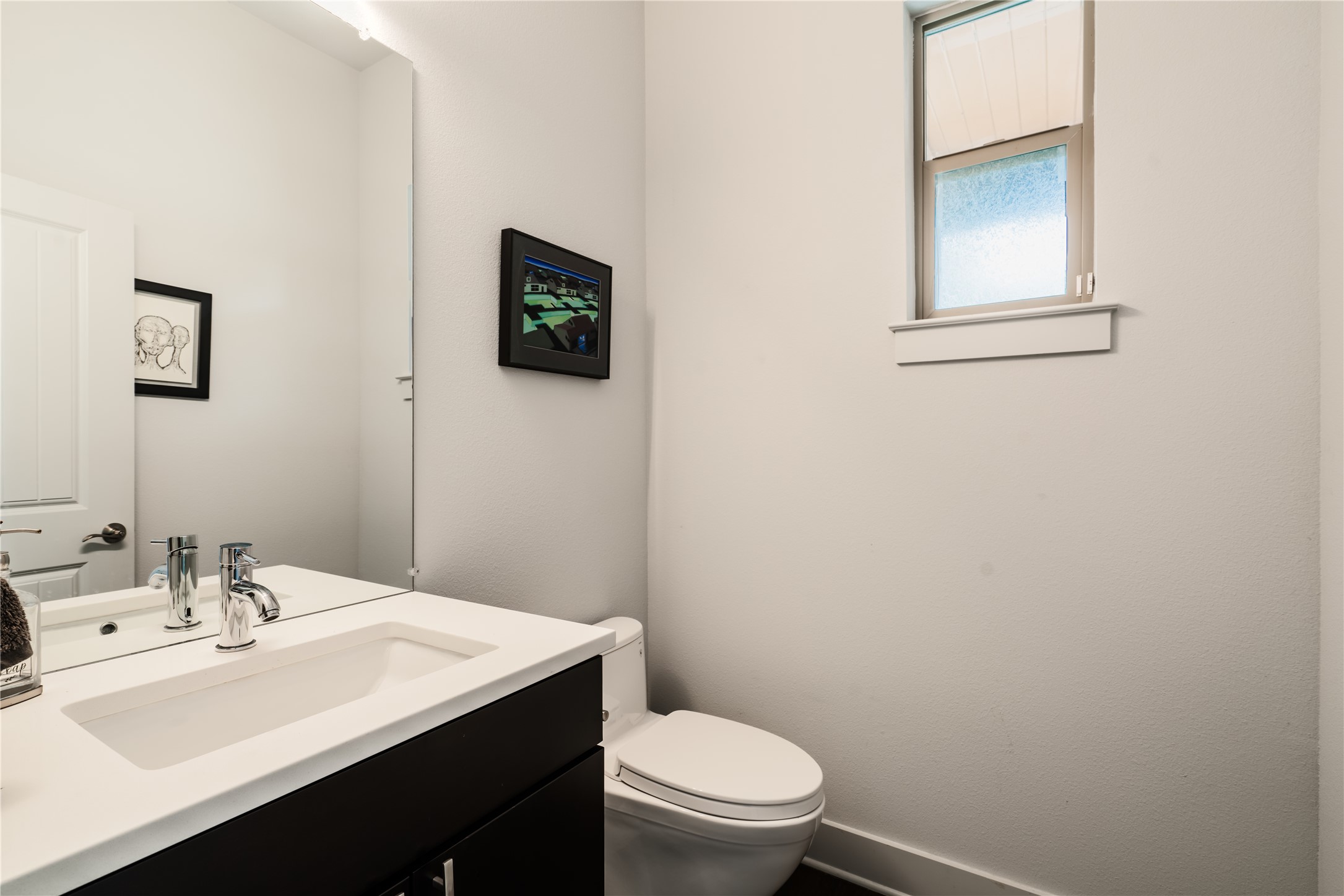 8110 Ranch Road 2222, Unit 36 Austin, TX 78730 - Photo 15 of 31 a bathroom with a sink a toilet and mirror