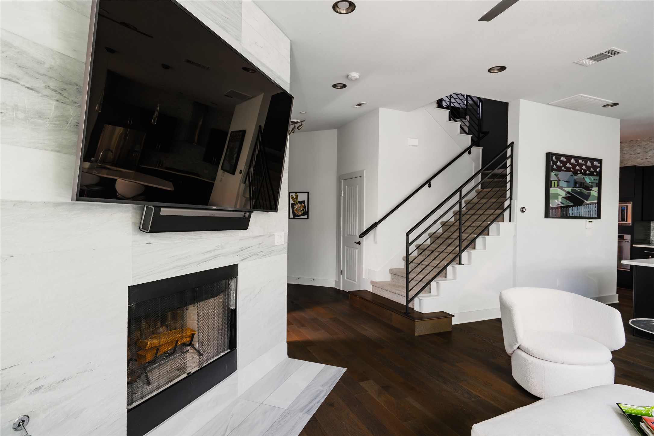 8110 Ranch Road 2222, Unit 36 Austin, TX 78730 - Photo 16 of 31 a living room with a fireplace and a flat screen tv