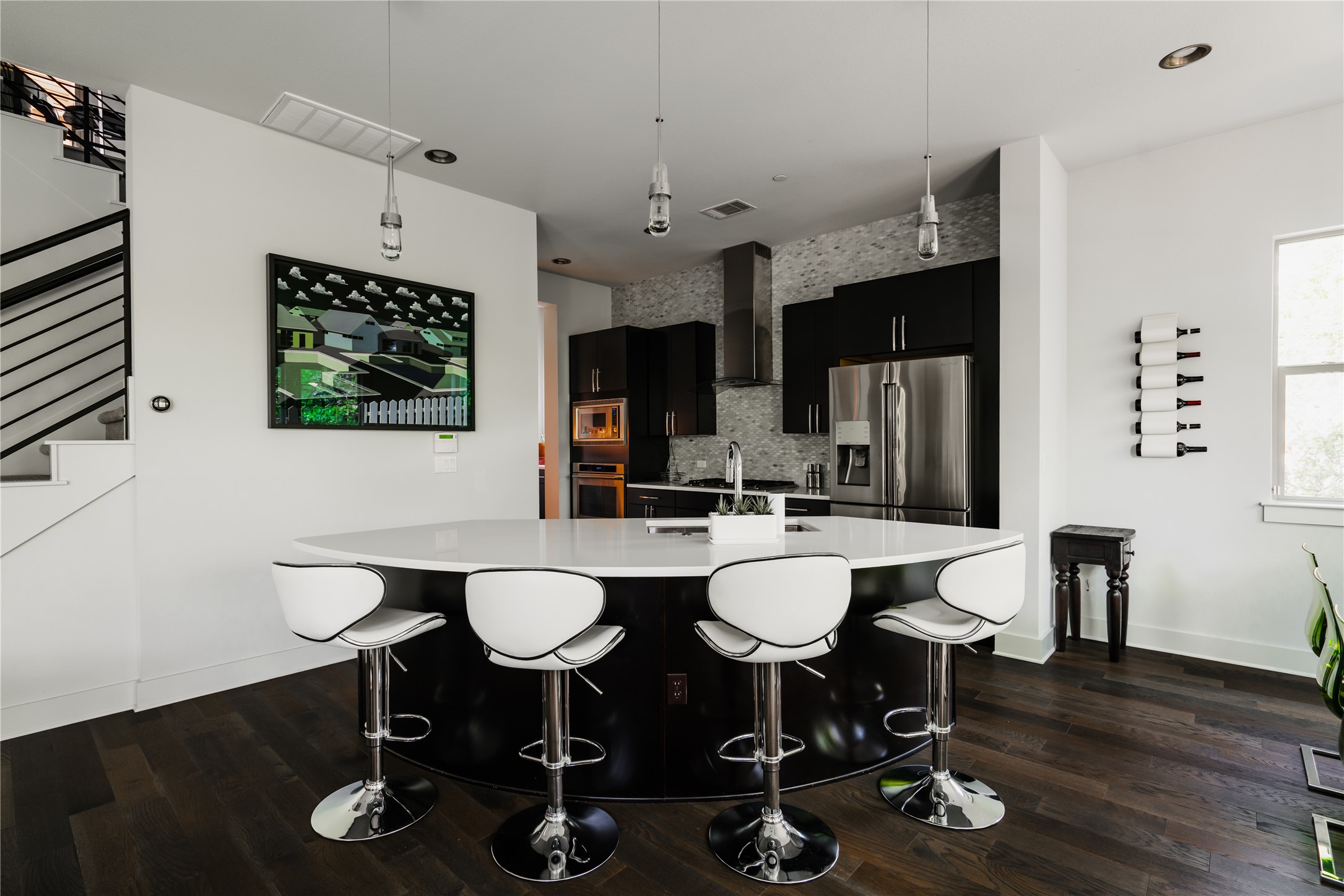 8110 Ranch Road 2222, Unit 36 Austin, TX 78730 - Photo 17 of 31 a view of a dining room with furniture and wooden floor