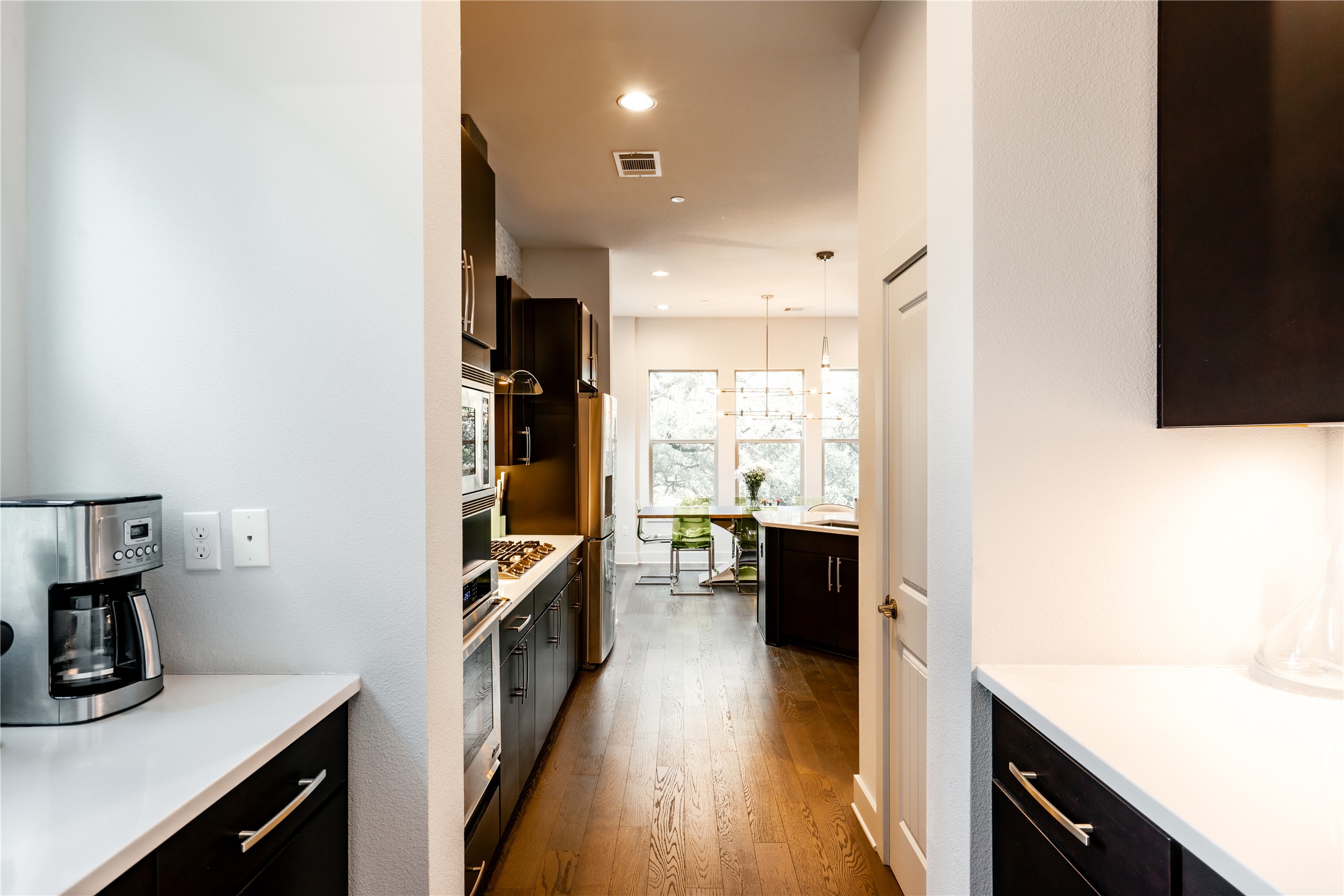8110 Ranch Road 2222, Unit 36 Austin, TX 78730 - Photo 18 of 31 a kitchen with a sink appliances and cabinets