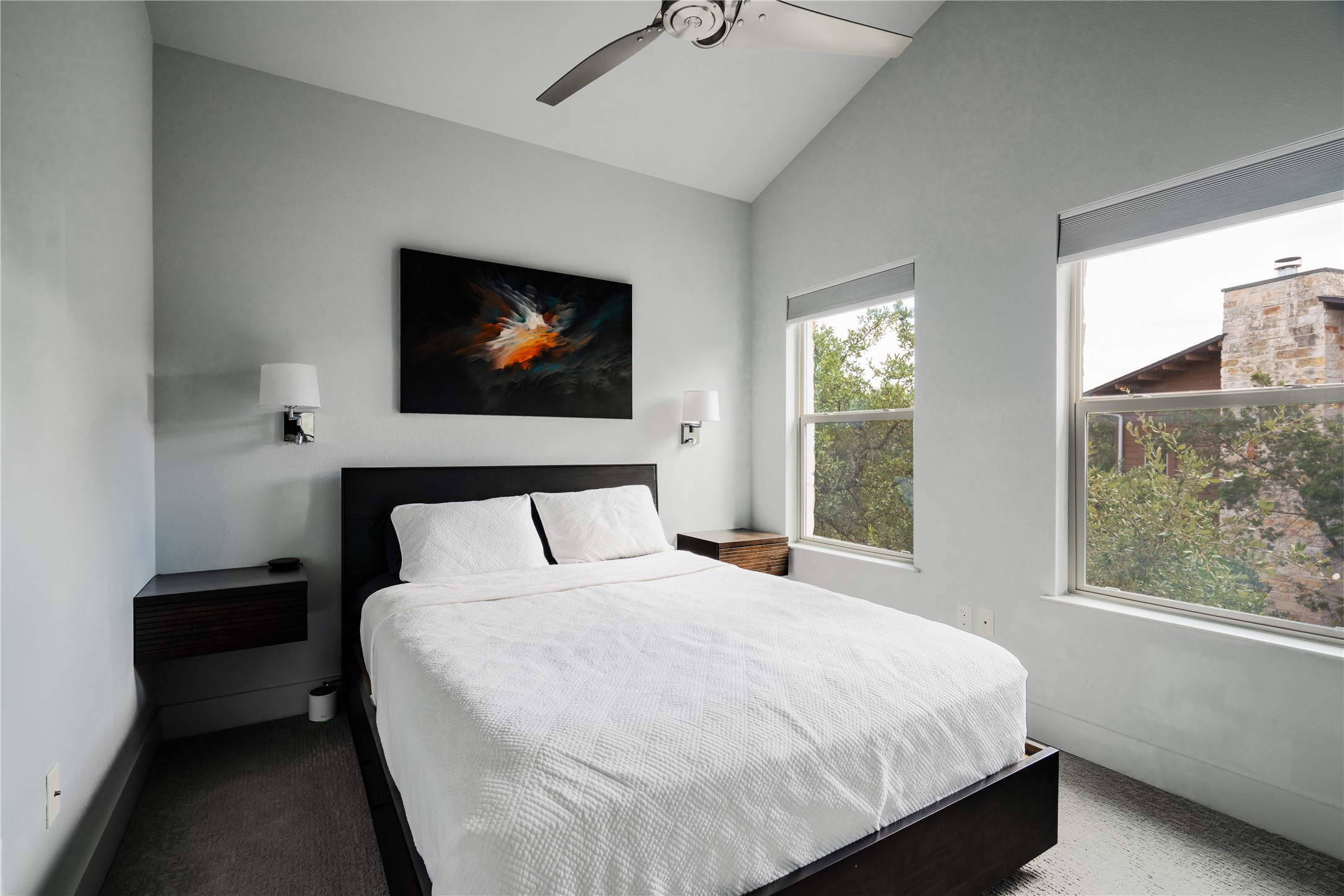 8110 Ranch Road 2222, Unit 36 Austin, TX 78730 - Photo 22 of 31 a bedroom with a bed and a window