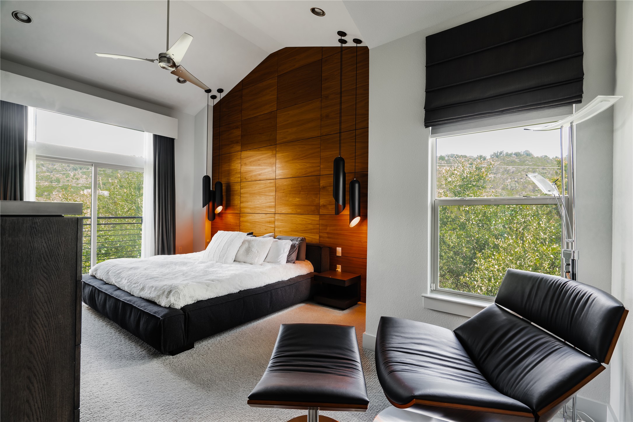 8110 Ranch Road 2222, Unit 36 Austin, TX 78730 - Photo 23 of 31 a bedroom with furniture and wooden floor