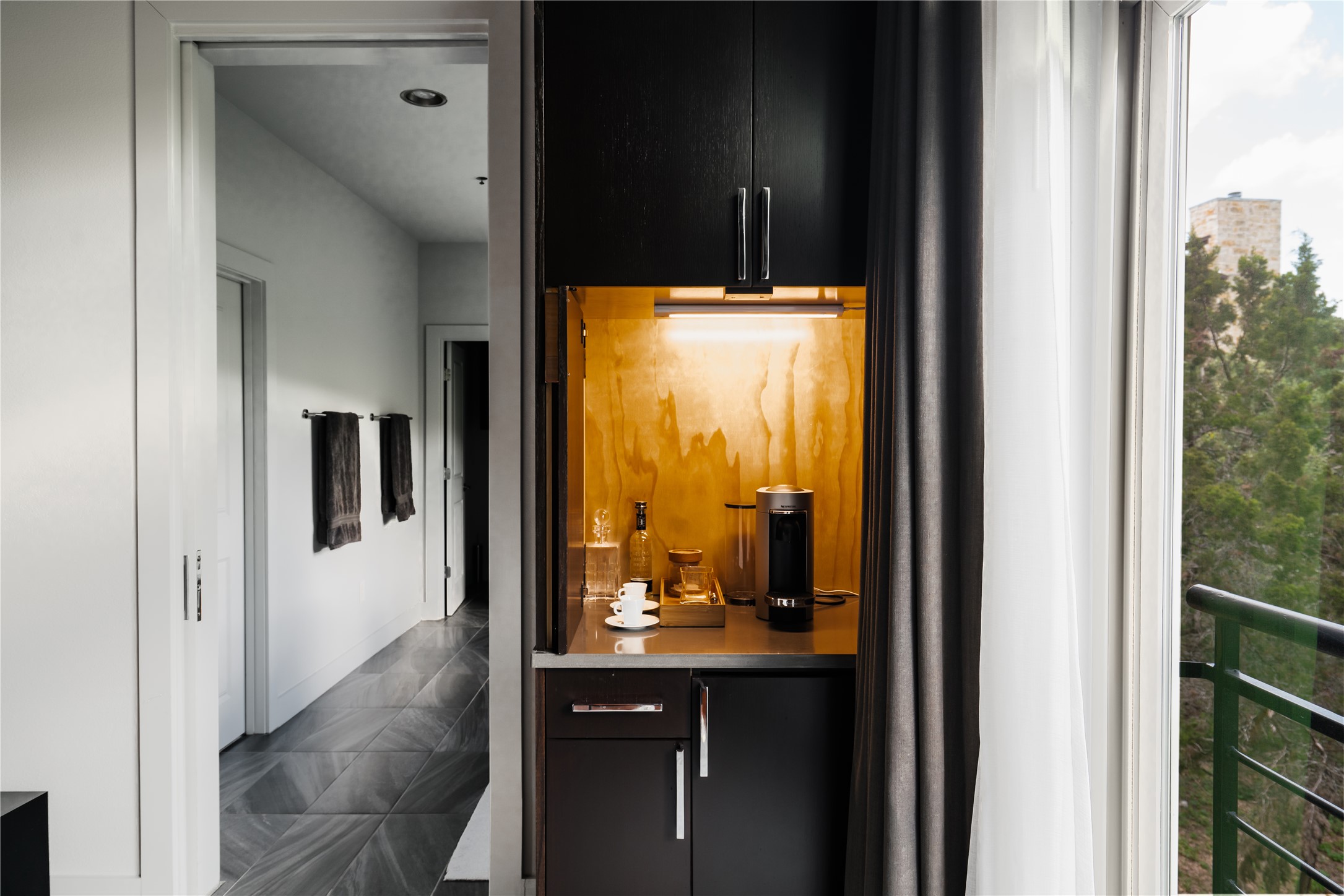 8110 Ranch Road 2222, Unit 36 Austin, TX 78730 - Photo 24 of 31 a view of a bathroom from a hallway