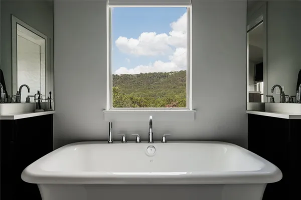 a bathroom with a granite countertop sink