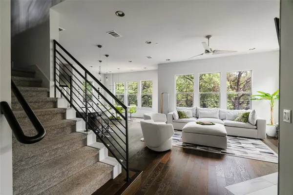 a living room with furniture or couches and a large window