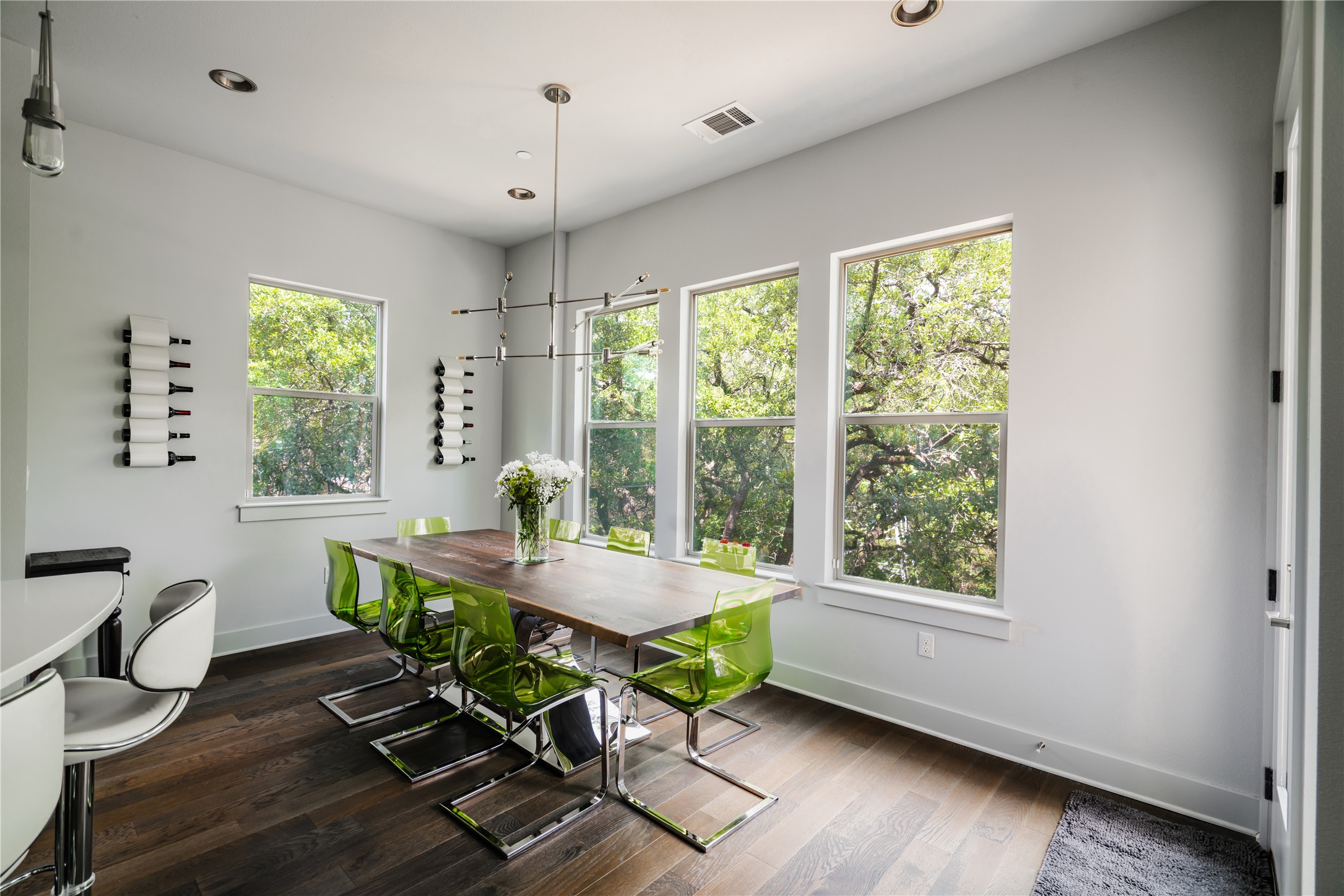 8110 Ranch Road 2222, Unit 36 Austin, TX 78730 - Photo 9 of 31 a dining room with wooden floor and a window