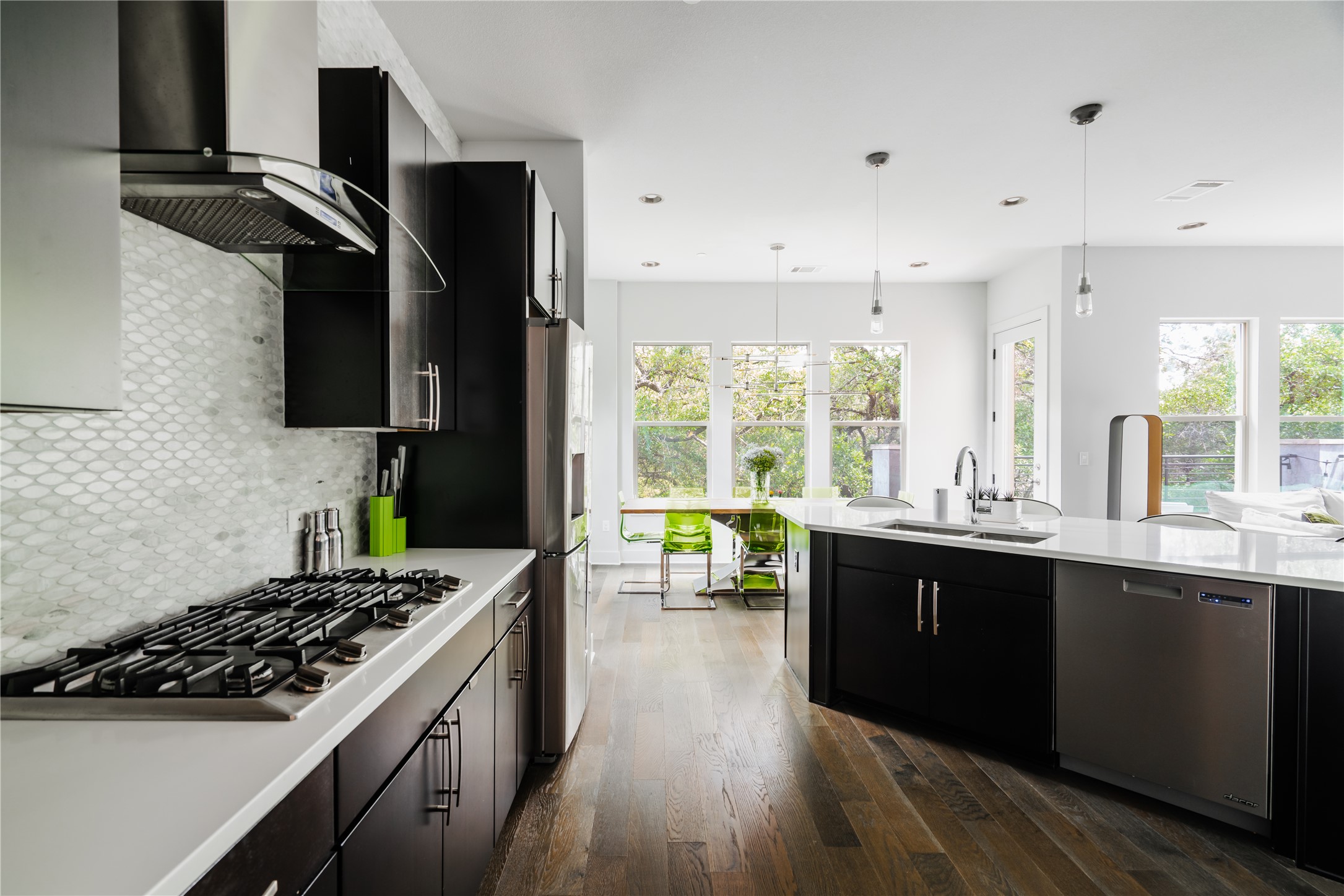 8110 Ranch Road 2222, Unit 36 Austin, TX 78730 - Photo 10 of 31 a kitchen with stainless steel appliances a sink cabinets and wooden floor