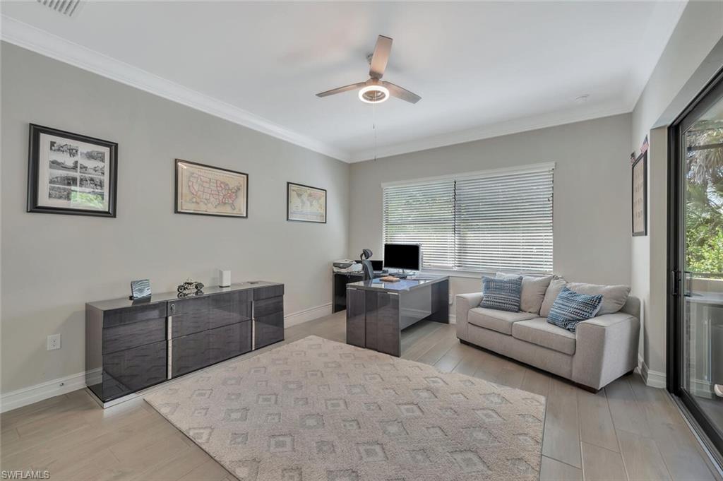 1451 Mockingbird Drive Naples, FL 34120 - Photo 20 of 42 a living room with furniture and windows