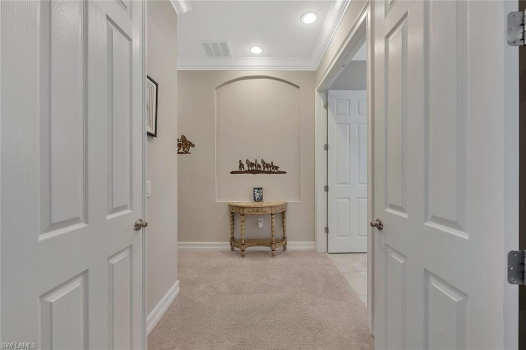 1451 Mockingbird Drive Naples, FL 34120 - Photo 22 of 42 a bathroom with a mirror