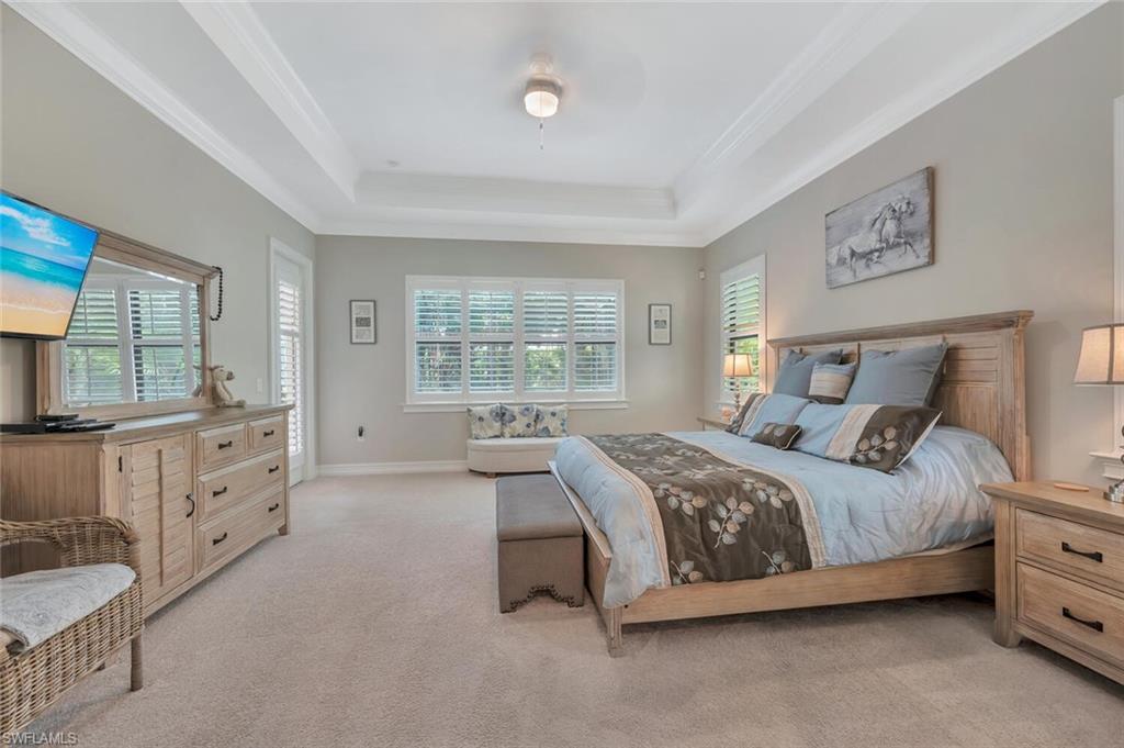 1451 Mockingbird Drive Naples, FL 34120 - Photo 24 of 42 a bedroom with a bed and a dresser