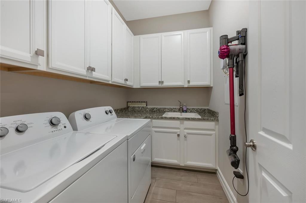 1451 Mockingbird Drive Naples, FL 34120 - Photo 35 of 42 a utility room with dryer and washer