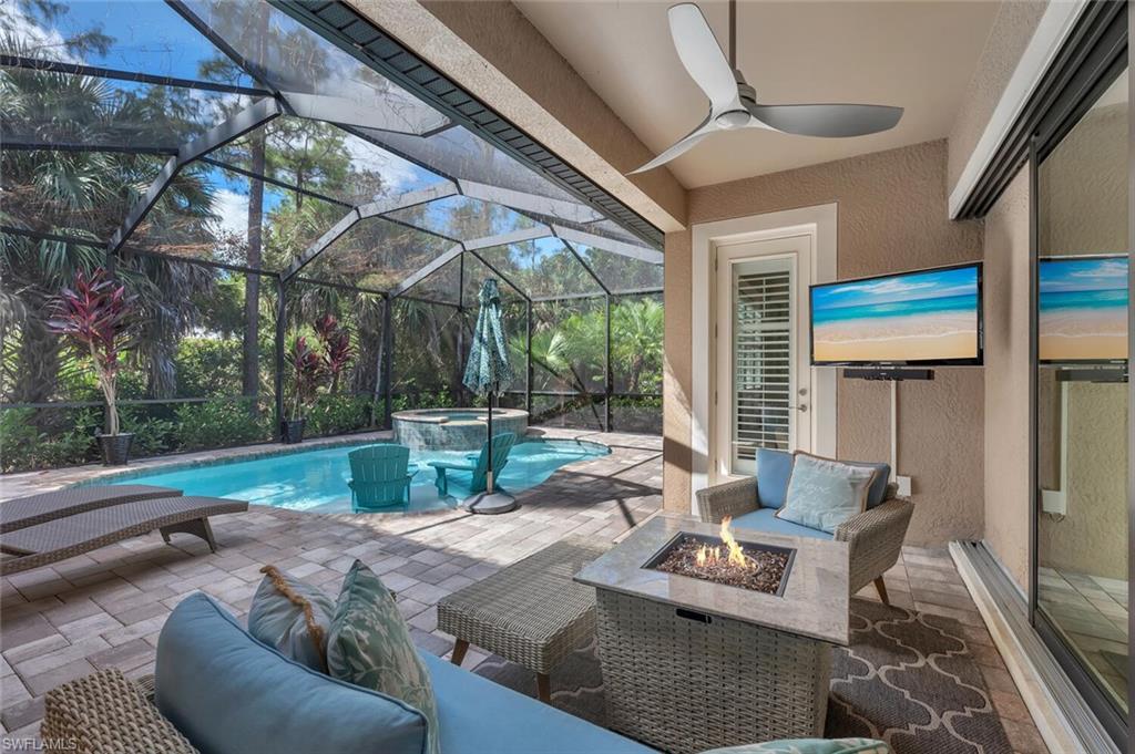 1451 Mockingbird Drive Naples, FL 34120 - Photo 36 of 42 a view of a patio with couches table and chairs and potted plants