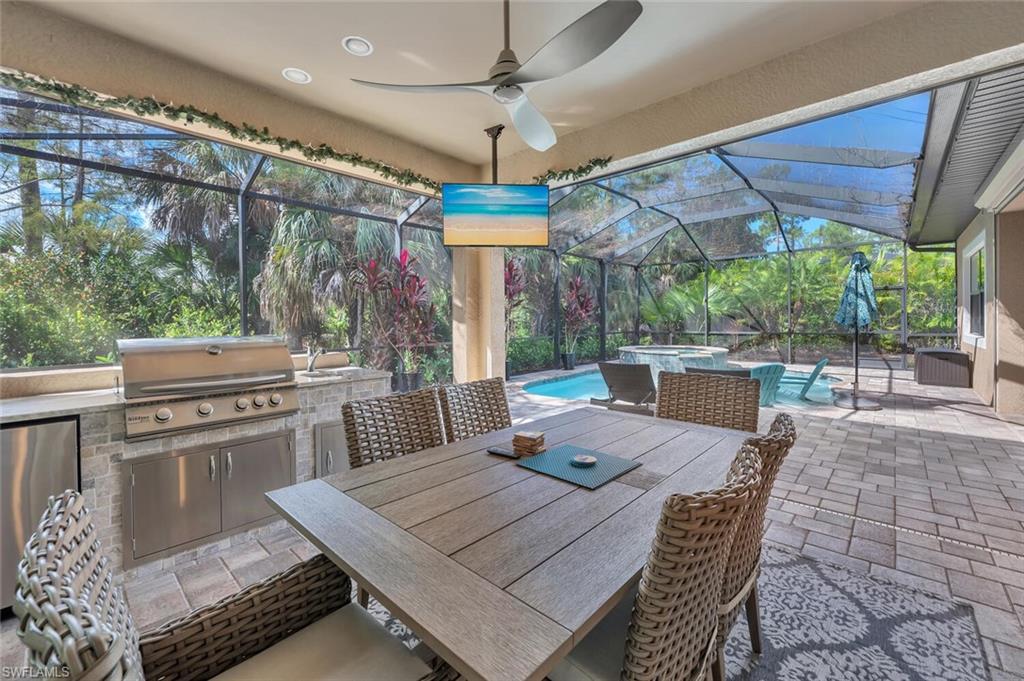 1451 Mockingbird Drive Naples, FL 34120 - Photo 39 of 42 a view of a dining table and chairs in patio