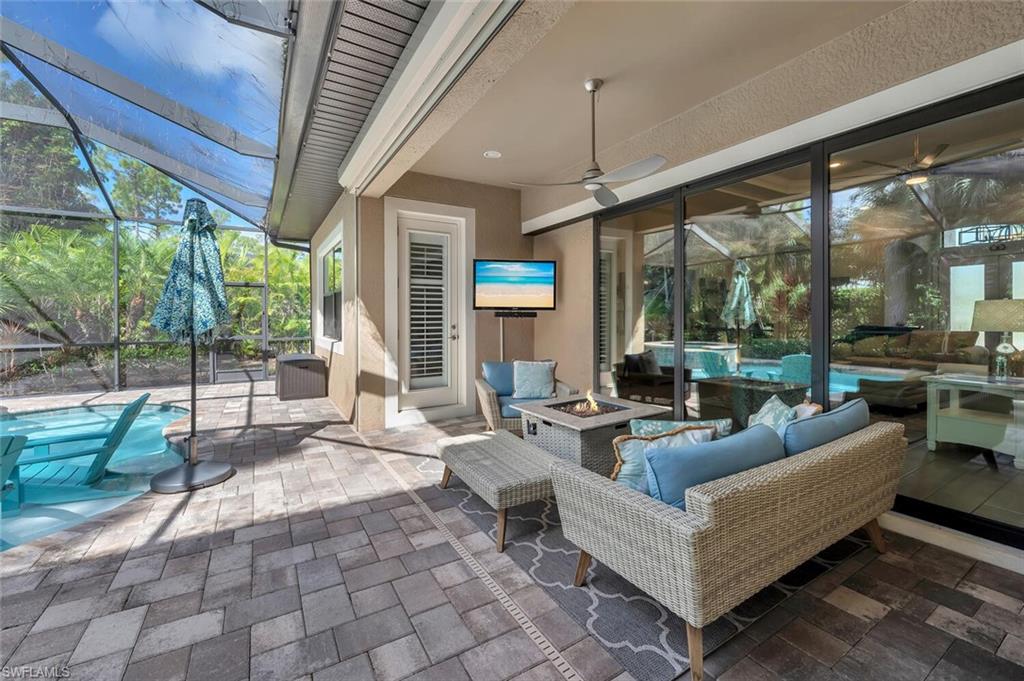 1451 Mockingbird Drive Naples, FL 34120 - Photo 41 of 42 a living room with patio furniture and a large window