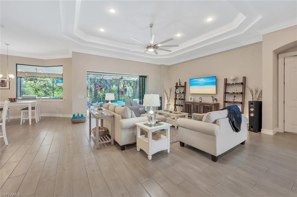 1451 Mockingbird Drive Naples, FL 34120 - Photo 6 of 42 a living room with furniture and a large window