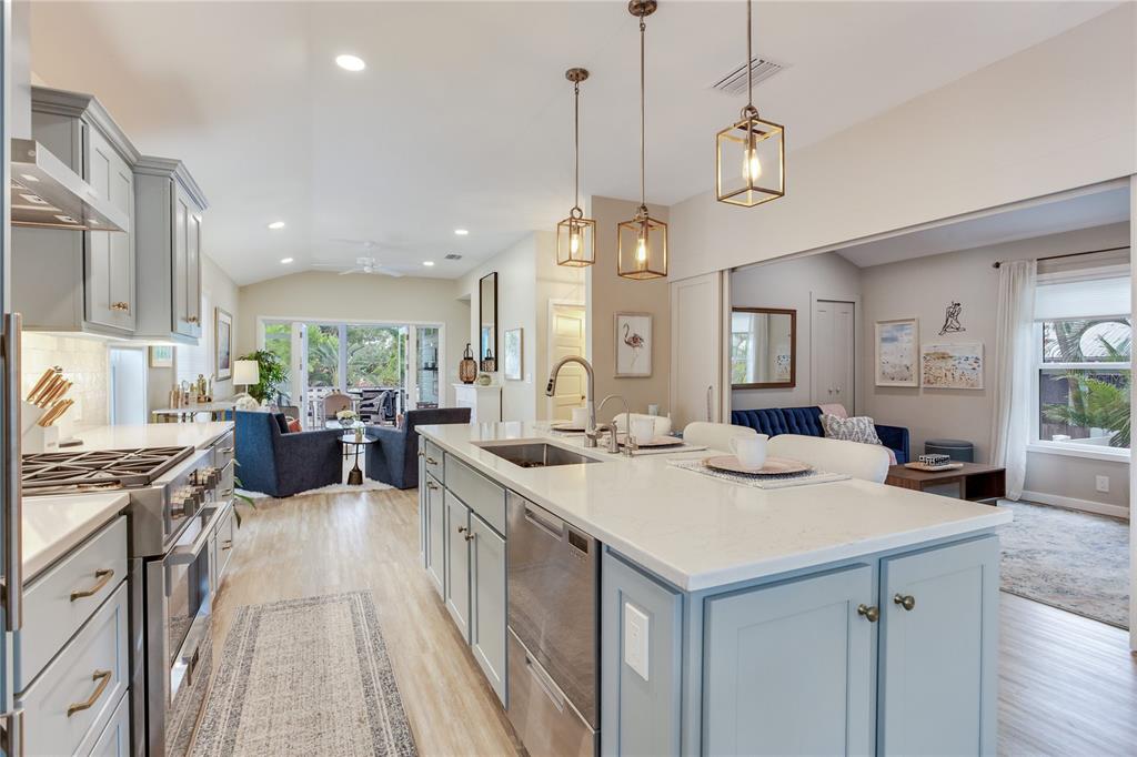 652 Ohio Place Sarasota, FL 34236 - Photo 12 of 61 a view of a kitchen counter top space a sink stainless steel appliances and cabinets