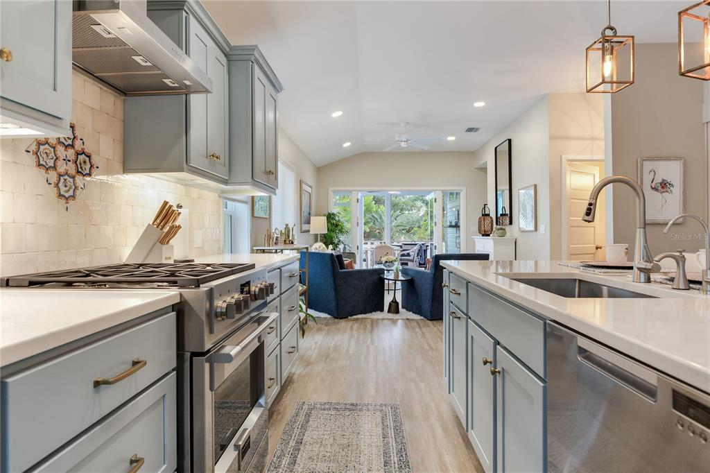 652 Ohio Place Sarasota, FL 34236 - Photo 13 of 61 a kitchen with a stove sink and cabinets