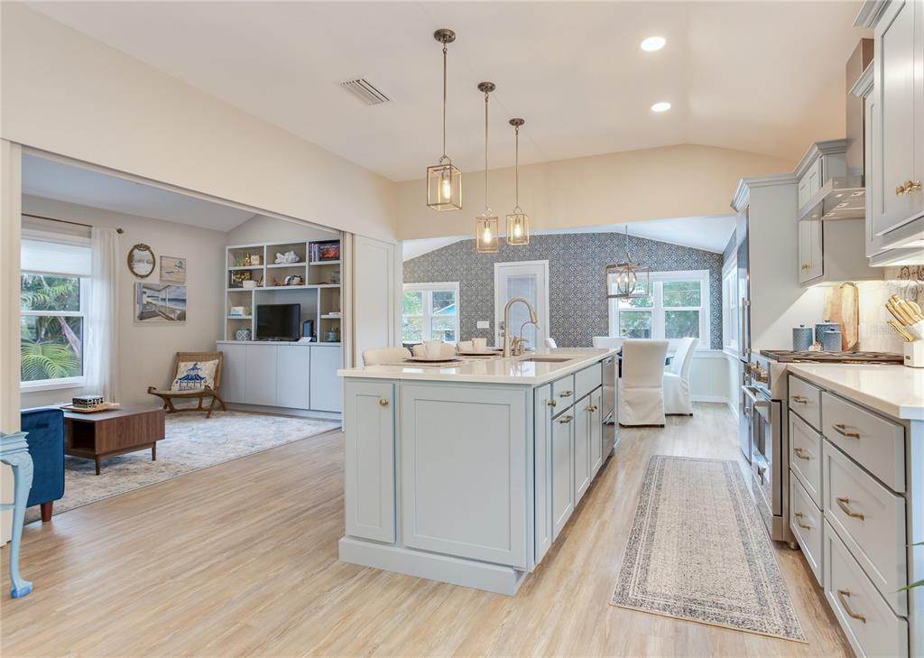 652 Ohio Place Sarasota, FL 34236 - Photo 15 of 61 a large white kitchen with a large window and stainless steel appliances