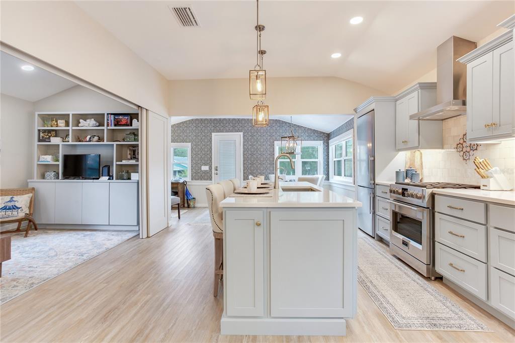 652 Ohio Place Sarasota, FL 34236 - Photo 16 of 61 a kitchen with stainless steel appliances kitchen island granite countertop a stove and cabinets