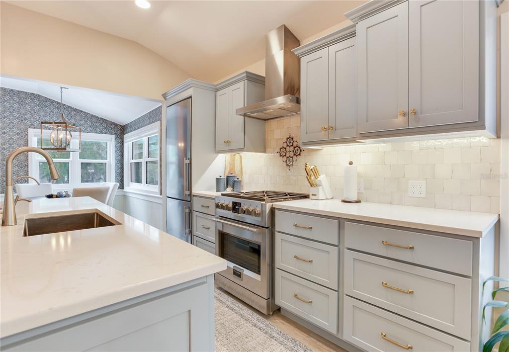 652 Ohio Place Sarasota, FL 34236 - Photo 17 of 61 a kitchen with granite countertop a sink stainless steel appliances and cabinets