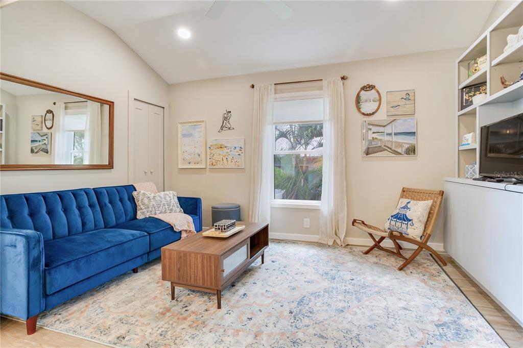 652 Ohio Place Sarasota, FL 34236 - Photo 20 of 61 a living room with furniture and a flat screen tv