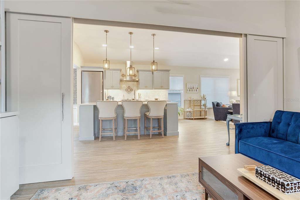 652 Ohio Place Sarasota, FL 34236 - Photo 21 of 61 a living room with furniture a large window and a table