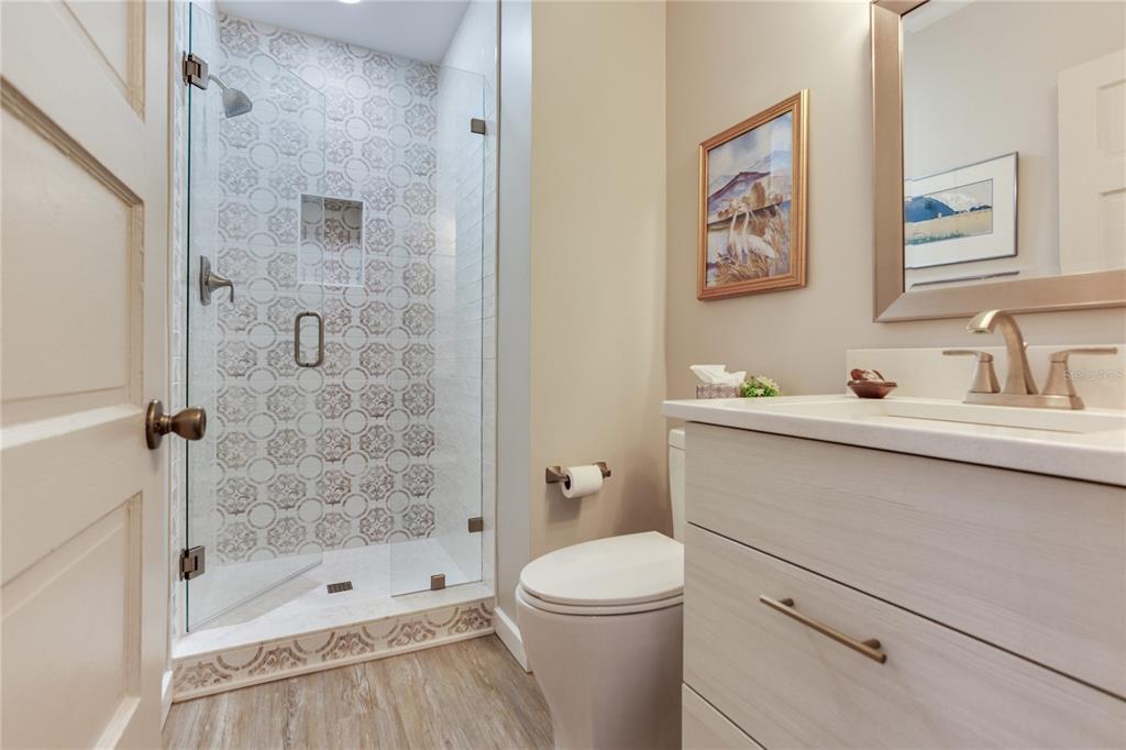 652 Ohio Place Sarasota, FL 34236 - Photo 24 of 61 a bathroom with a sink a toilet and shower