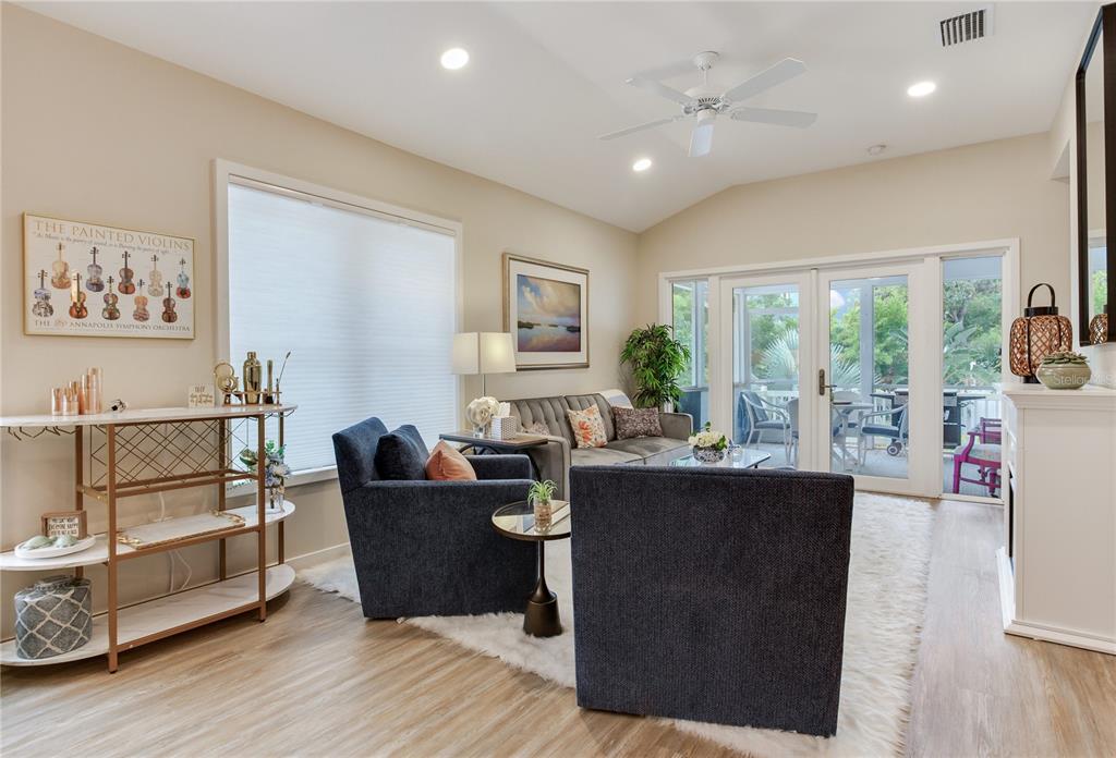 652 Ohio Place Sarasota, FL 34236 - Photo 26 of 61 a living room with furniture a large window and wooden floor