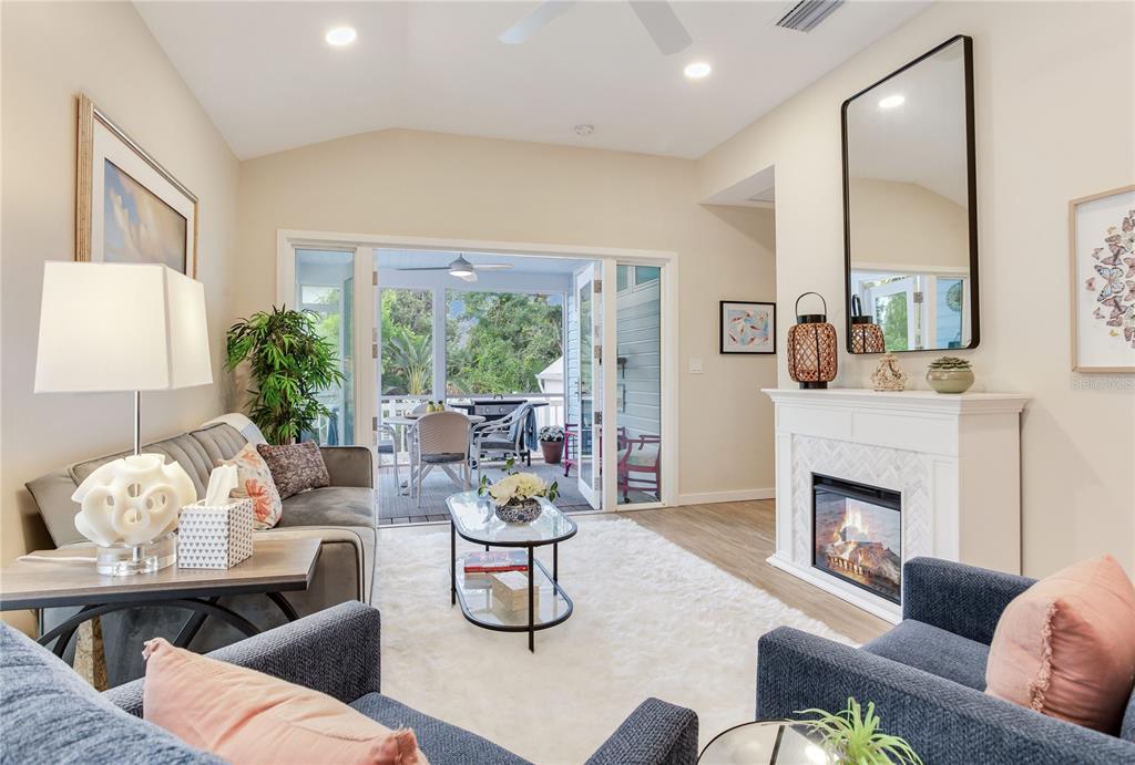 652 Ohio Place Sarasota, FL 34236 - Photo 27 of 61 a living room with furniture fireplace and a large window