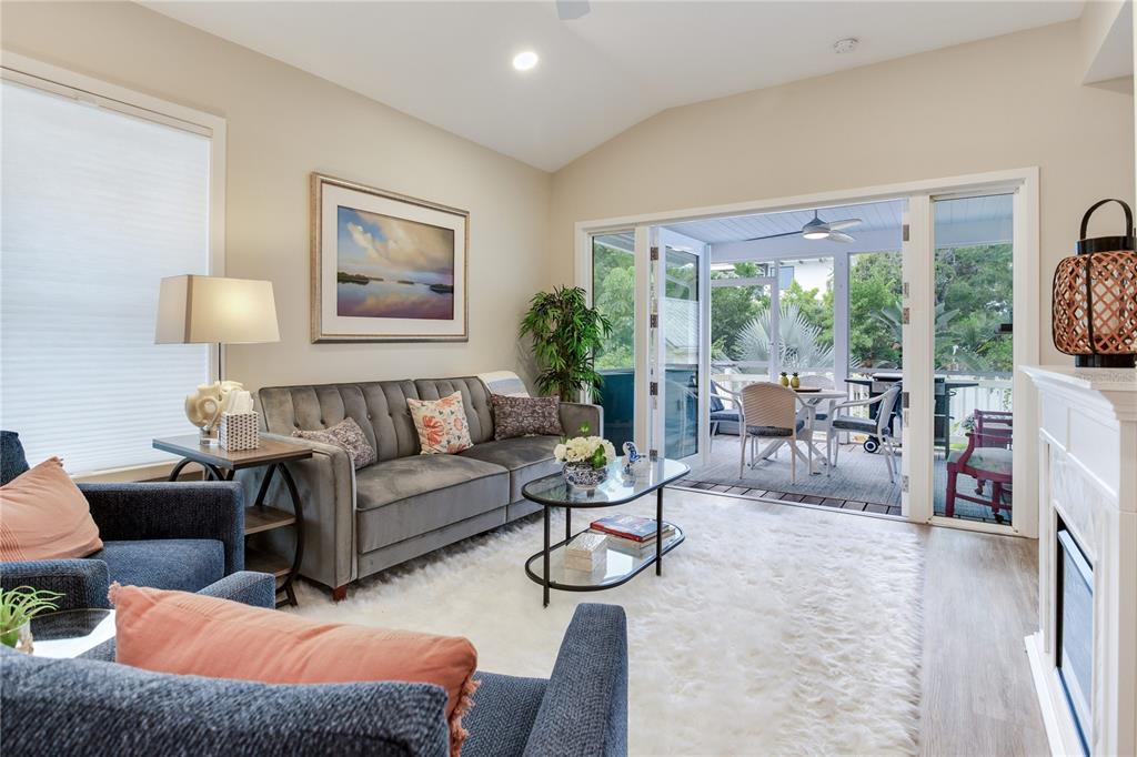 652 Ohio Place Sarasota, FL 34236 - Photo 28 of 61 a living room with furniture a flat screen tv and a large window