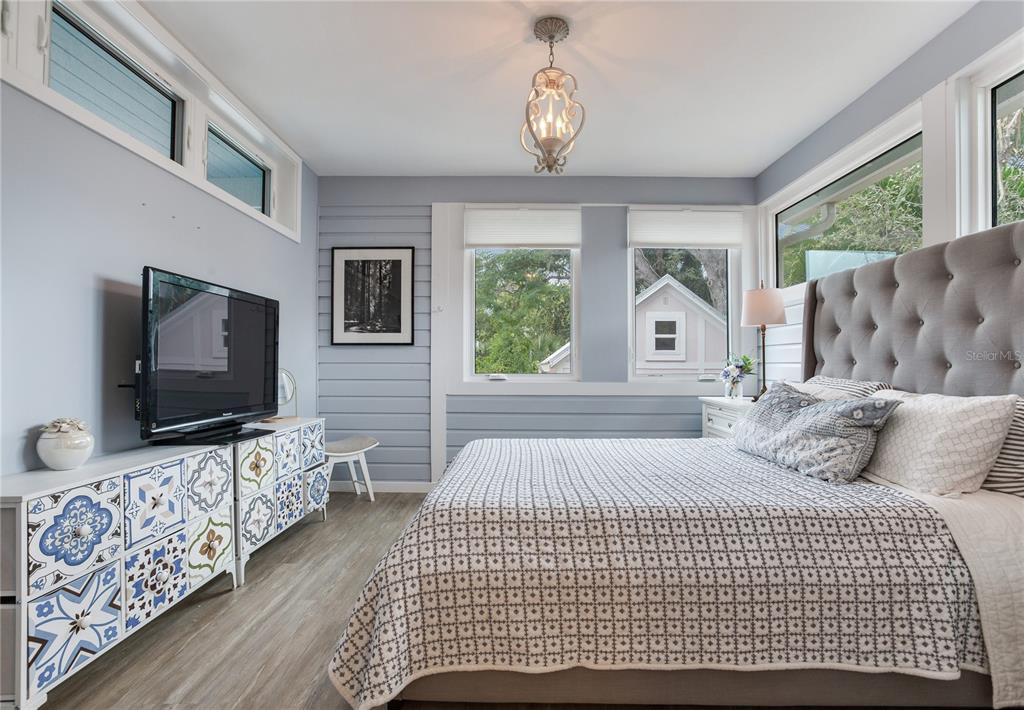 652 Ohio Place Sarasota, FL 34236 - Photo 33 of 61 a bedroom with a bed and a flat screen tv