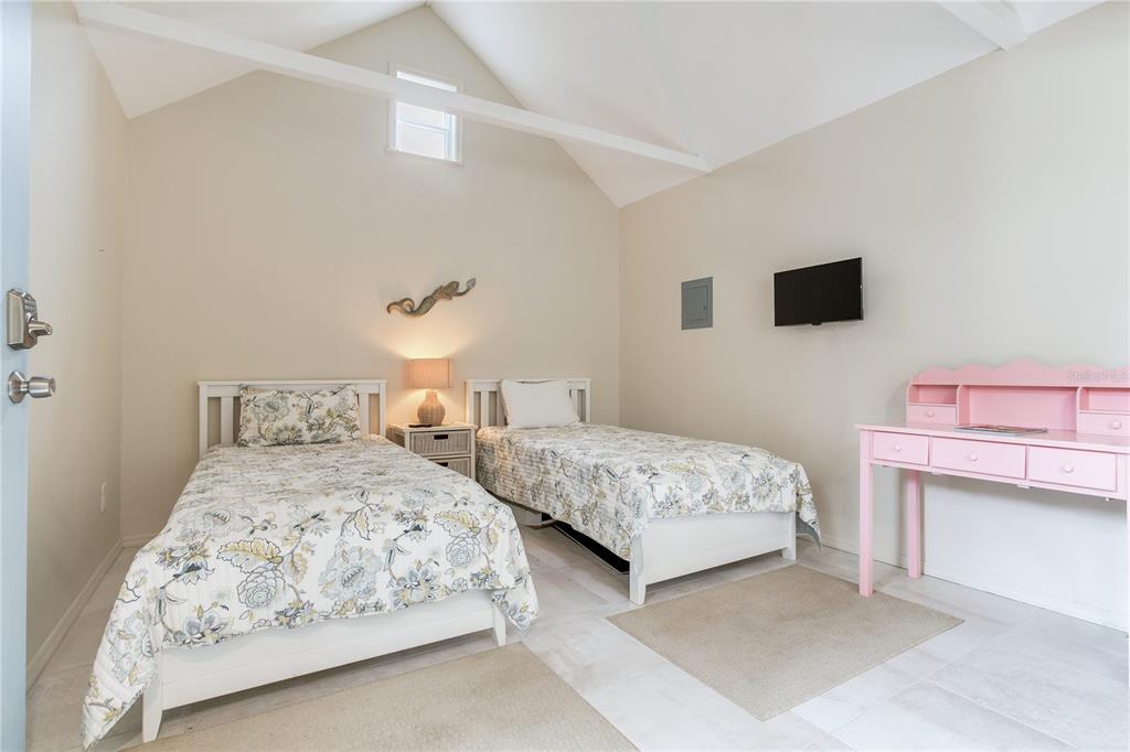 652 Ohio Place Sarasota, FL 34236 - Photo 42 of 61 a bedroom with two beds and a night stand