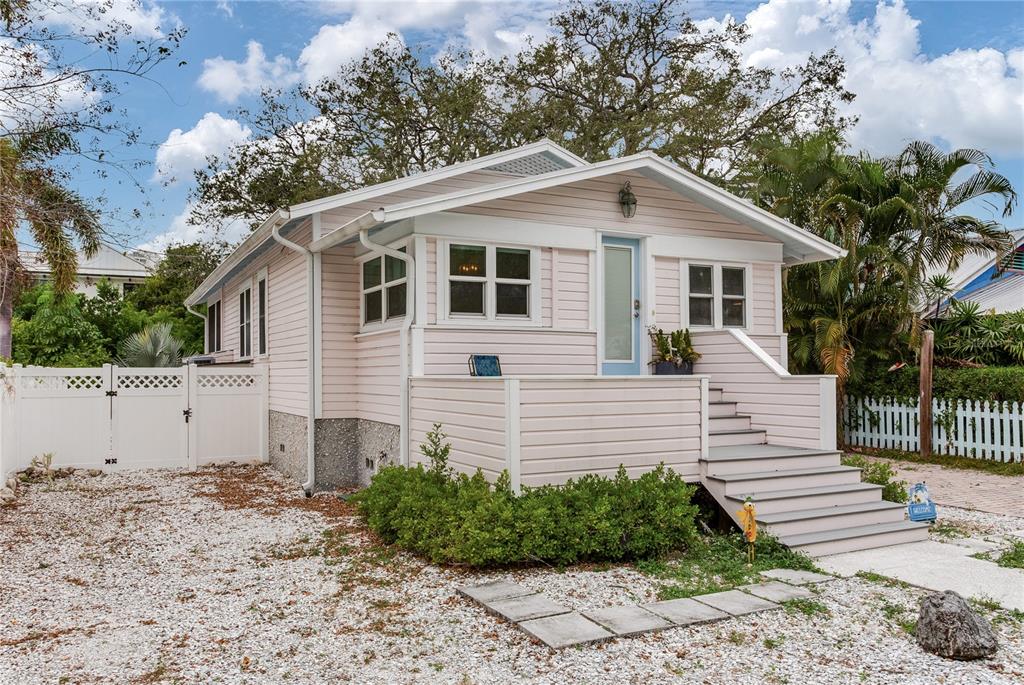 652 Ohio Place Sarasota, FL 34236 - Photo 48 of 61 a view of a white house next to a yard