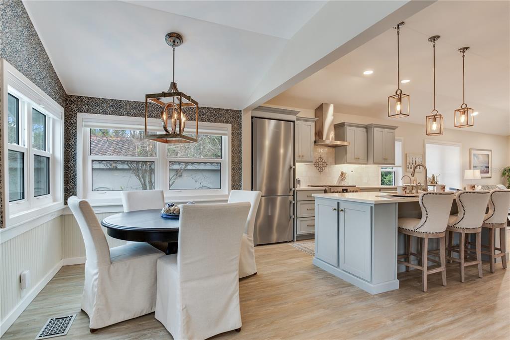 652 Ohio Place Sarasota, FL 34236 - Photo 7 of 61 a dining room with furniture a chandelier and kitchen view