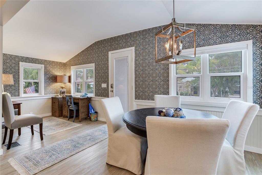 652 Ohio Place Sarasota, FL 34236 - Photo 9 of 61 a living room with furniture and a chandelier