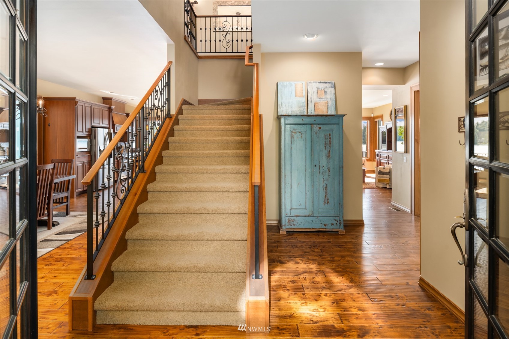 308 South Tulloch Road Snohomish, WA 98290 - Photo 16 of 40 a view of a hallway with wooden floor and staircase