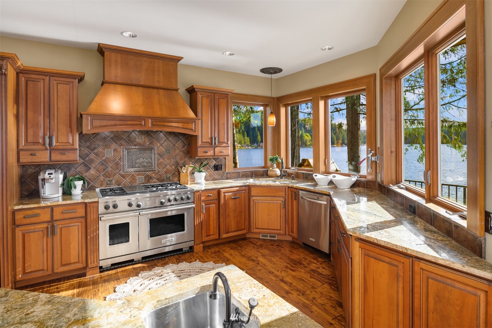 308 South Tulloch Road Snohomish, WA 98290 - Photo 6 of 40 a kitchen with a stove a sink and a refrigerator